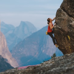 Rock climber Beth Rodden, scaling a mountain.